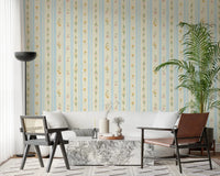 Classic floral pattern wallpaper featuring yellow blossoms and blue stripes.