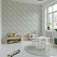 Soft sage green and beige motifs of the Vintage Folk Tiles Green Wallpaper.