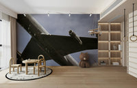 A contemplative vintage bomber wallpaper mural for a feature wall.

