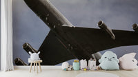 An artistic military plane mural on minimalist wallpaper.

