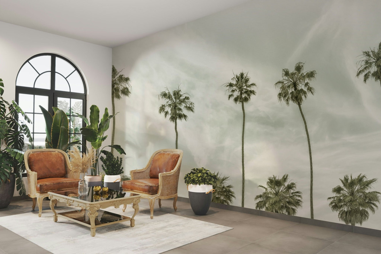 Retro-style mural featuring tall palm trees and sunny skies.

