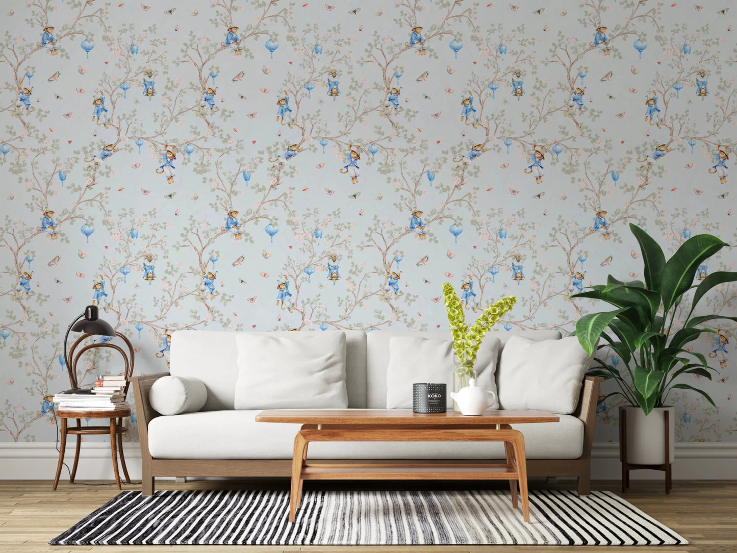 Living room styled with blue chinoiserie monkey wallpaper and wood console