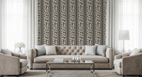 A striped botanical repeat gives the Trailing Foliage Brown Wallpaper orderly depth