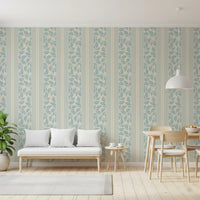 Soft botanical repeats give the Trailing Foliage Powder Blue Wallpaper calm movement