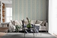 Fine vertical bands frame this Powder Blue Wallpaper with trailing foliage design