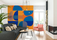Corner of a bright dining room featuring the bold Vivid Geometry Wall Mural.