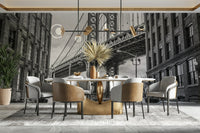 The view is from a cobblestone street in a city neighborhood.

