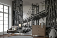 Old brick buildings with many windows line both sides of the street.


