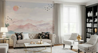 Watercolor Mountain Haze wallpaper behind a contemporary fabric sofa.