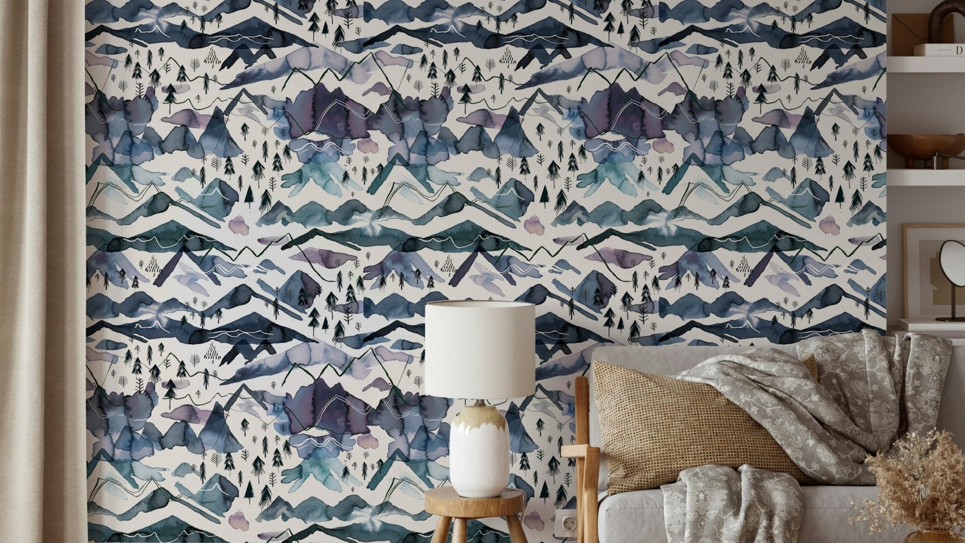 Dreamy watercolor mountain wallpaper in blue and mauve tones.

