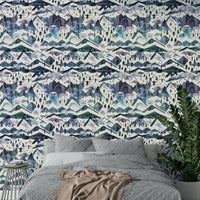 Elegant watercolor mountain wallpaper in blue and mauve shades.

