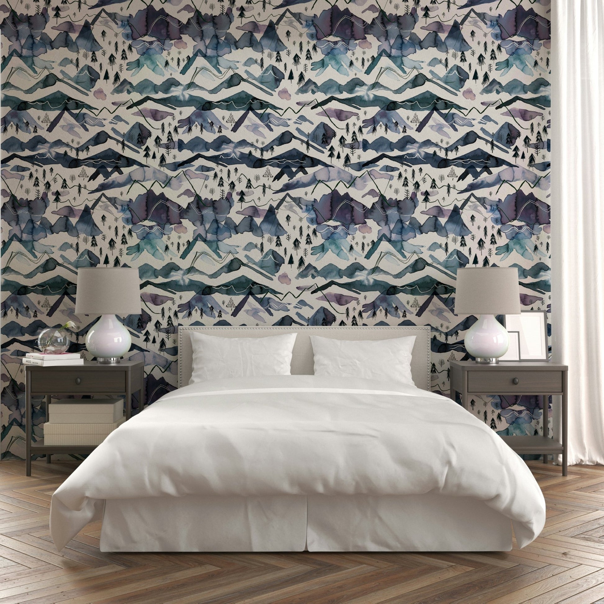 Serene watercolor mountain landscape with blue hues wallpaper.

