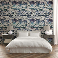 Serene watercolor mountain landscape with blue hues wallpaper.

