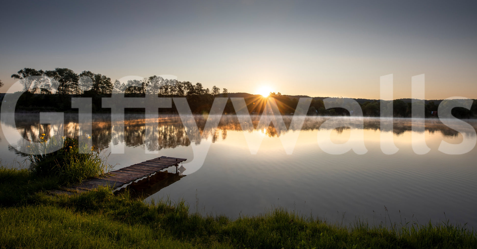 Captures the essence of a tranquil sunrise over a peaceful lake.
