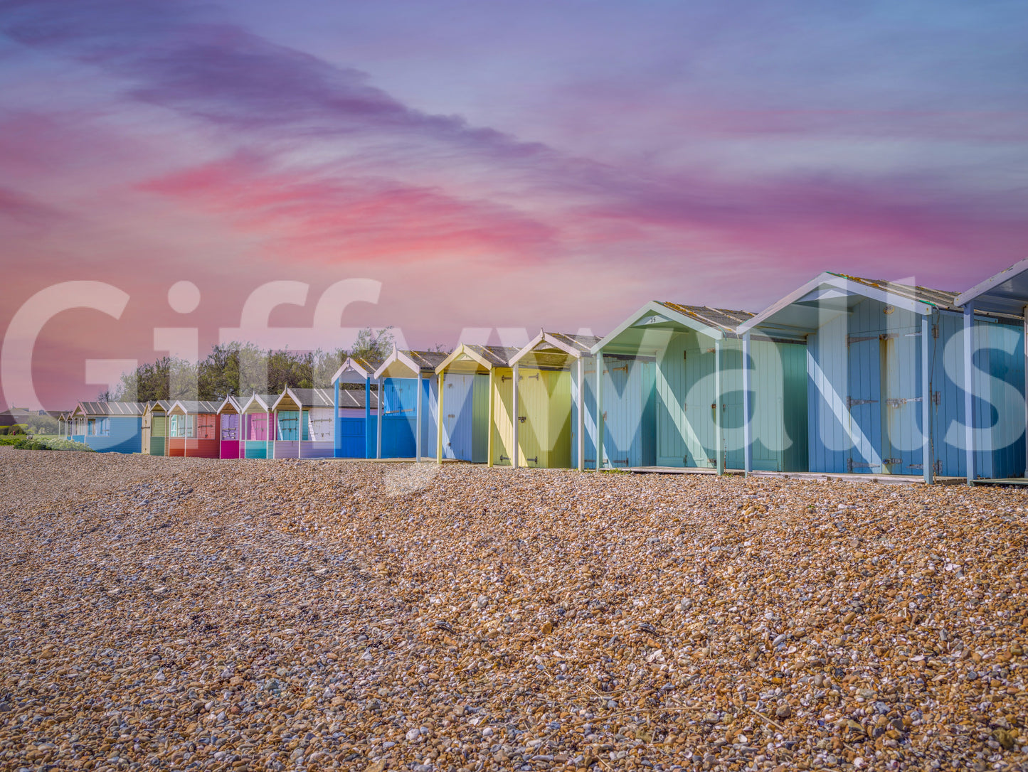 A detail of the warm tones in the beach huts and sky.

