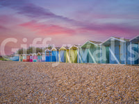 A detail of the warm tones in the beach huts and sky.

