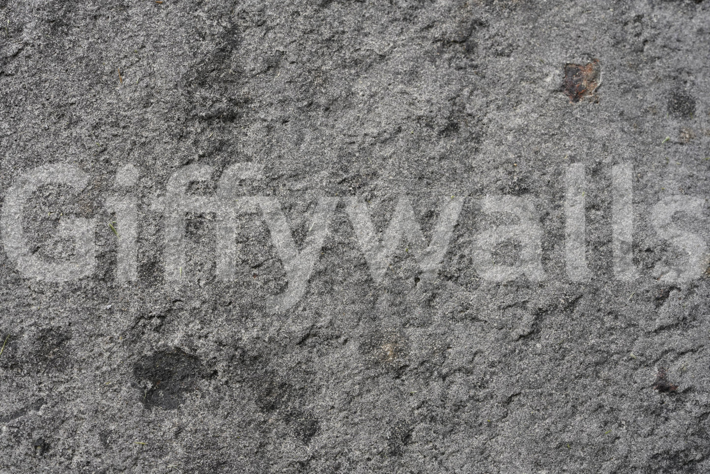 Corner view of gray peel and stick feature wall.