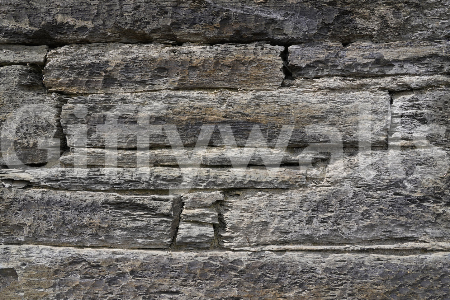 Horizontal stacked stone wallpaper close detail.