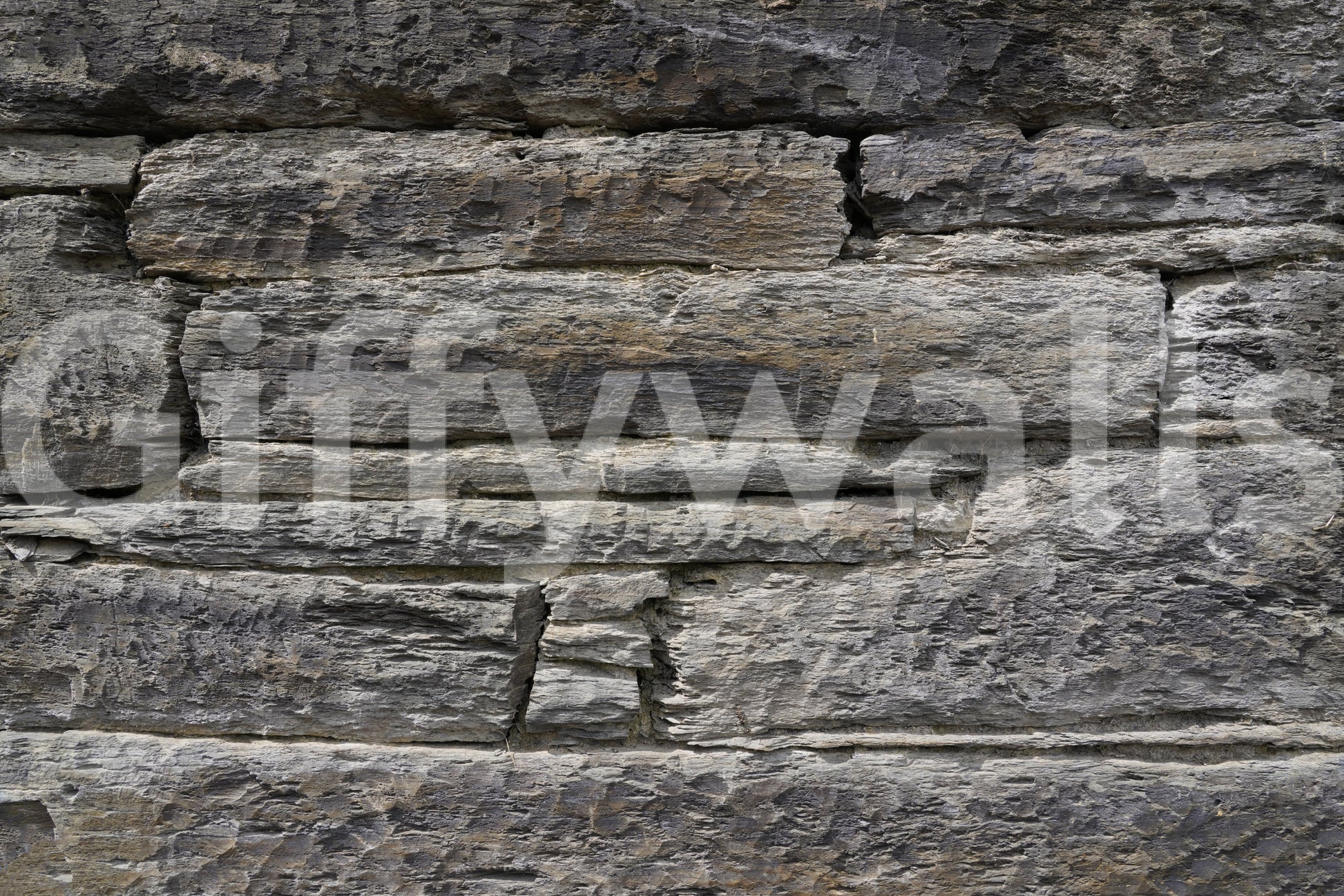 Horizontal stacked stone wallpaper close detail.