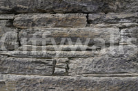 Horizontal stacked stone wallpaper close detail.