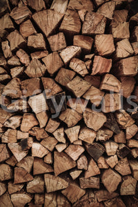 Rustic charm of the Woodpile Texture peel and stick mural behind a wood stove.