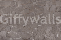 Rustic Stone wallpaper in a kitchen with white cabinets.