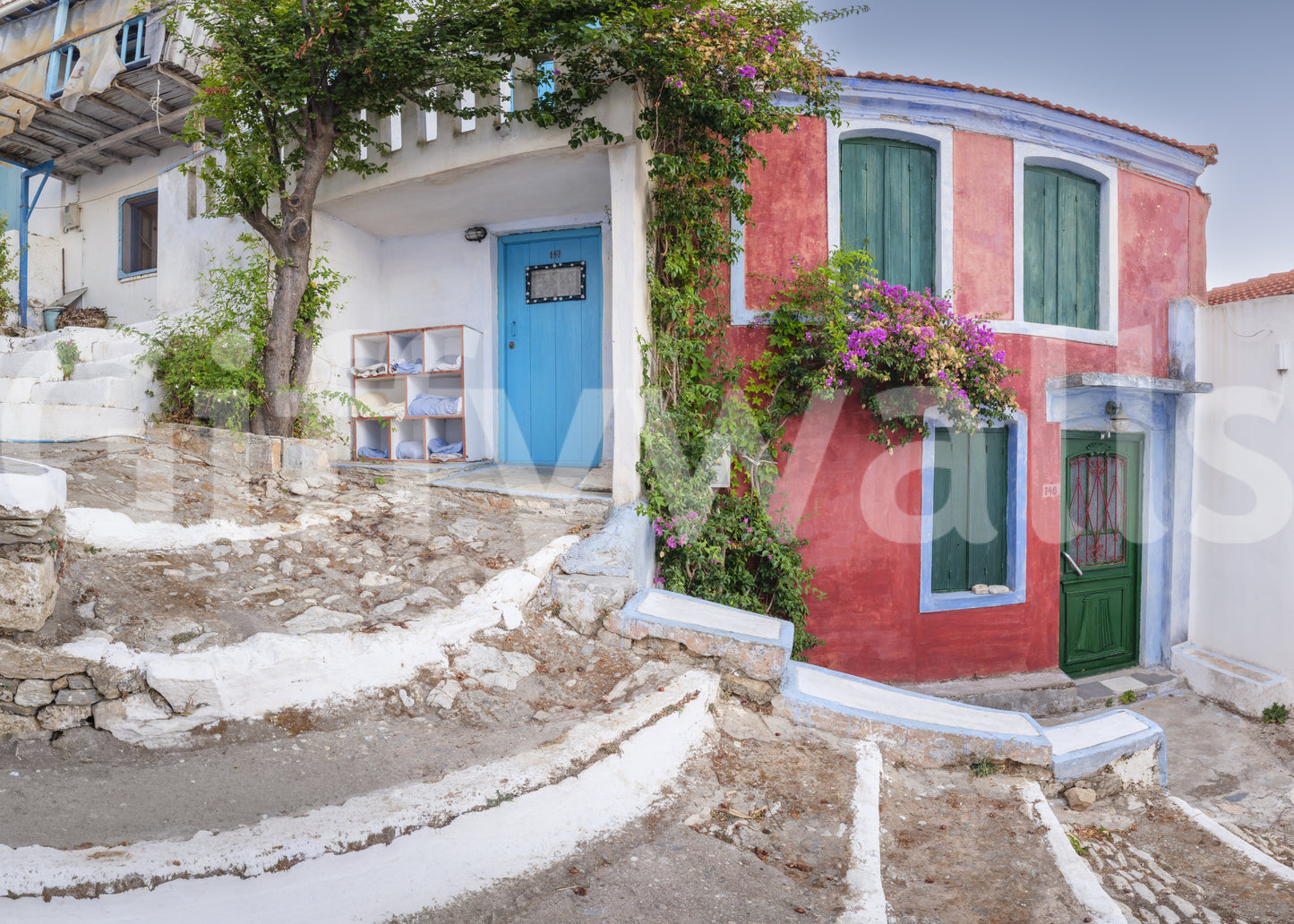 Turquoise and red buildings Coastal Cottage Charm Wall Mural