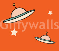 Orange glow background highlights these stylized spaceship drawings in the mural.