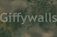 Verdant Mist forest wall mural with warm ochre undertones and dark green foliage