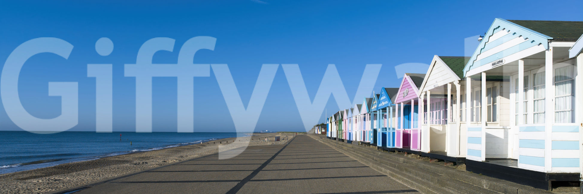 Coastal beach hut panoramic wall mural clear sky and sandy shoreline, GD9711