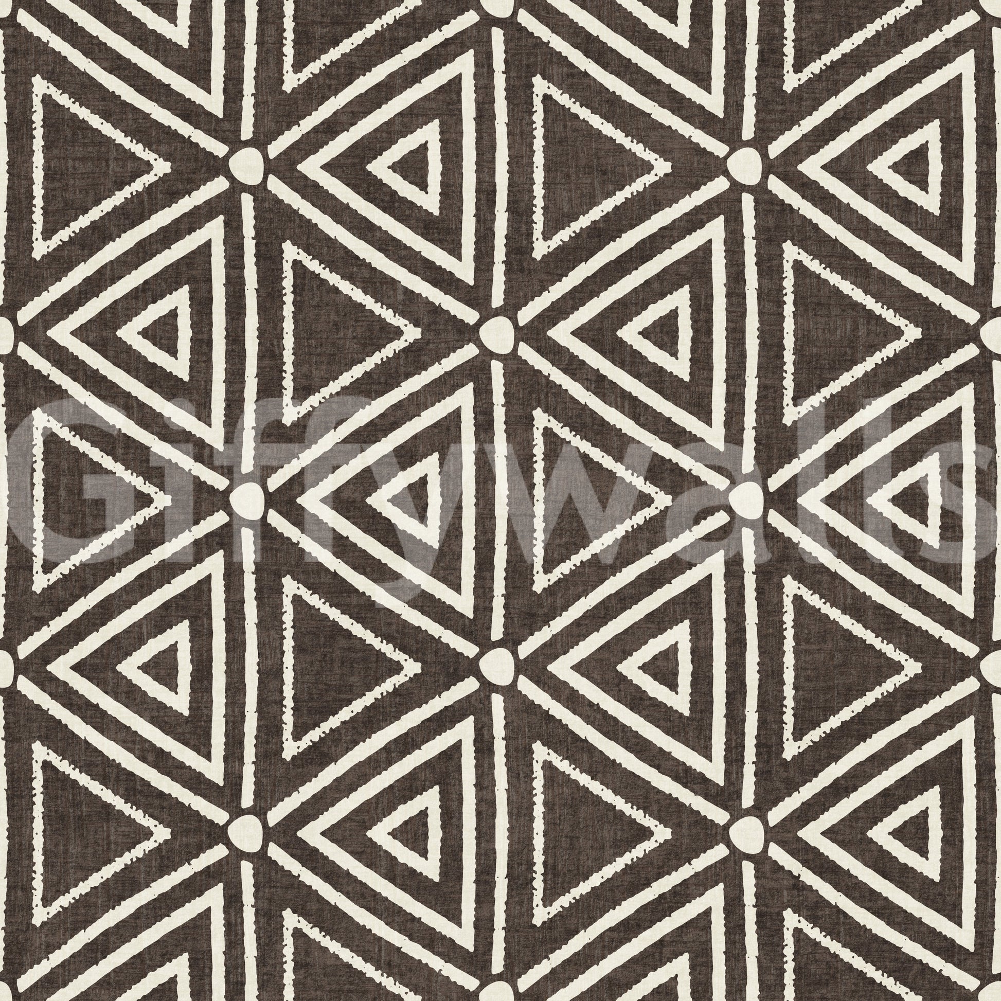 Mudcloth-style nested triangles laid on umber wallpaper in cream and brown