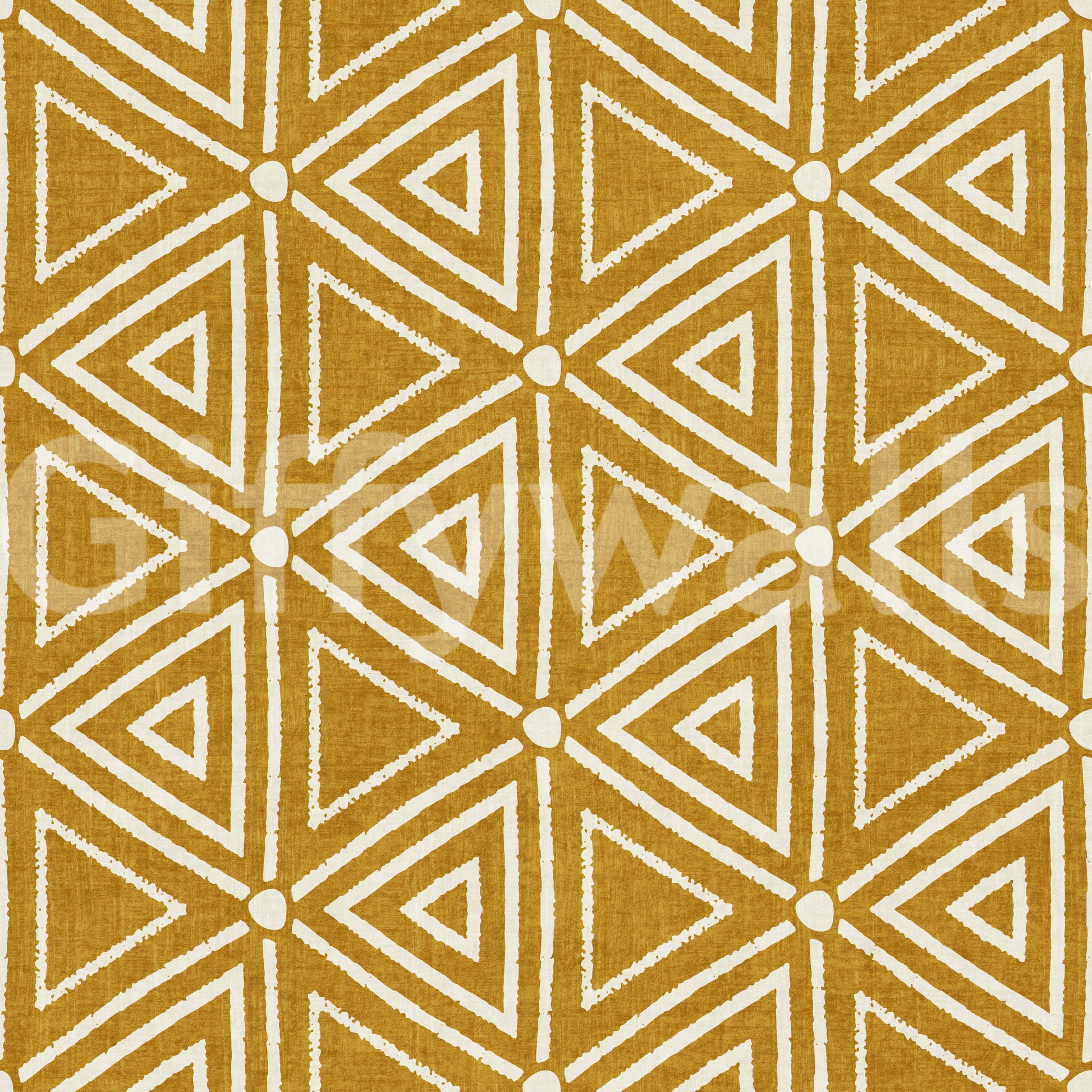 Mudcloth wallpaper layering chalky triangles and small dots on a mustard ground.