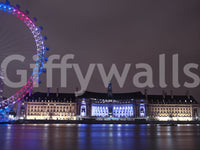 Magenta-pink wheel lights mirrored on Thames waters in a London Embankment wall mural., GD9738