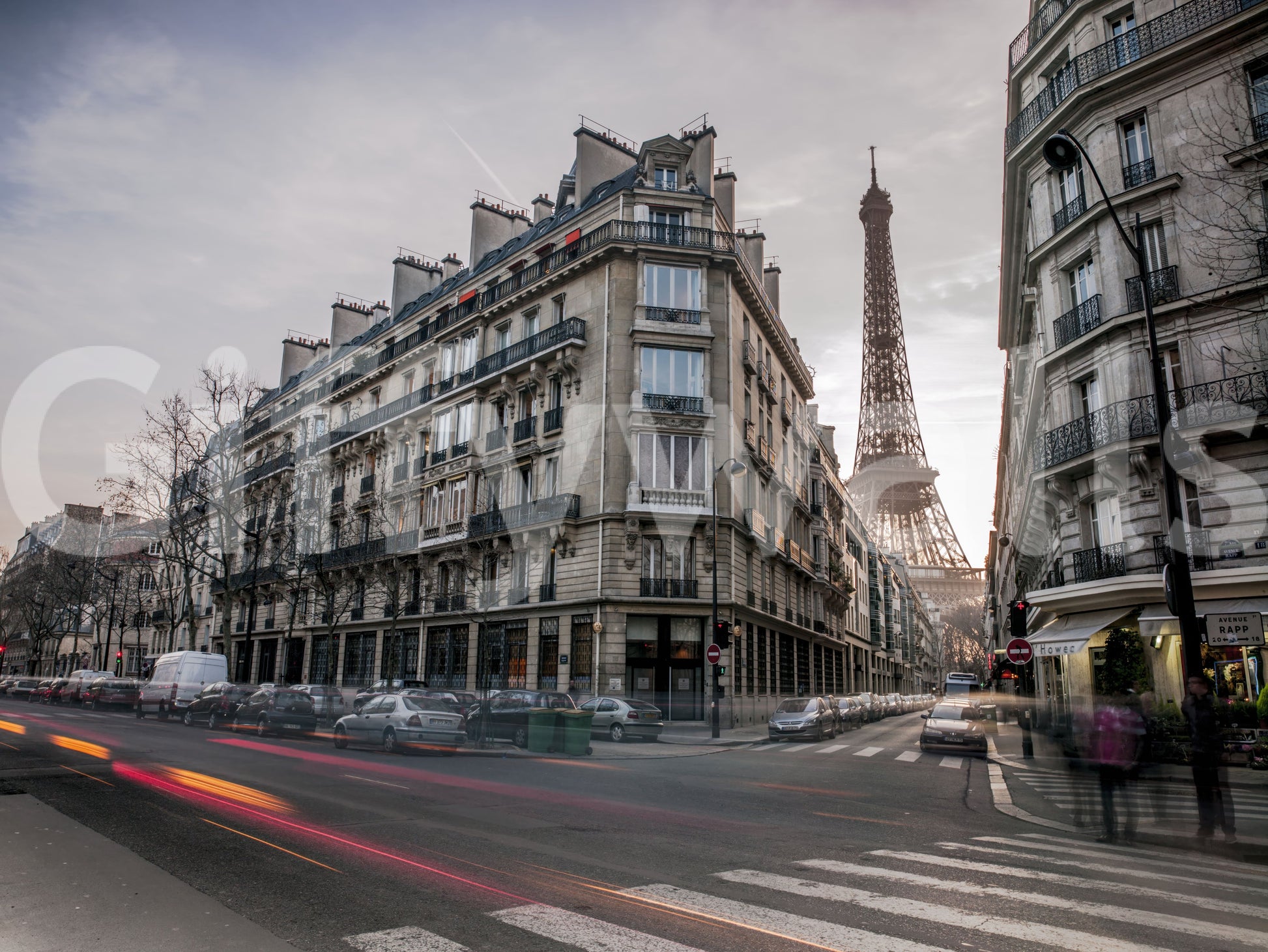 Parisian architecture with evening light and urban street wall mural.