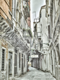 Historic urban street wall mural with drain pipes and Venetian details.