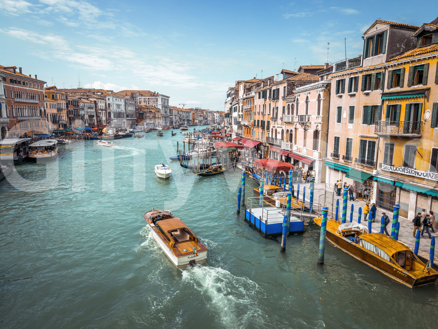 Historic architecture wall mural with turquoise canal and blue sky vista view.