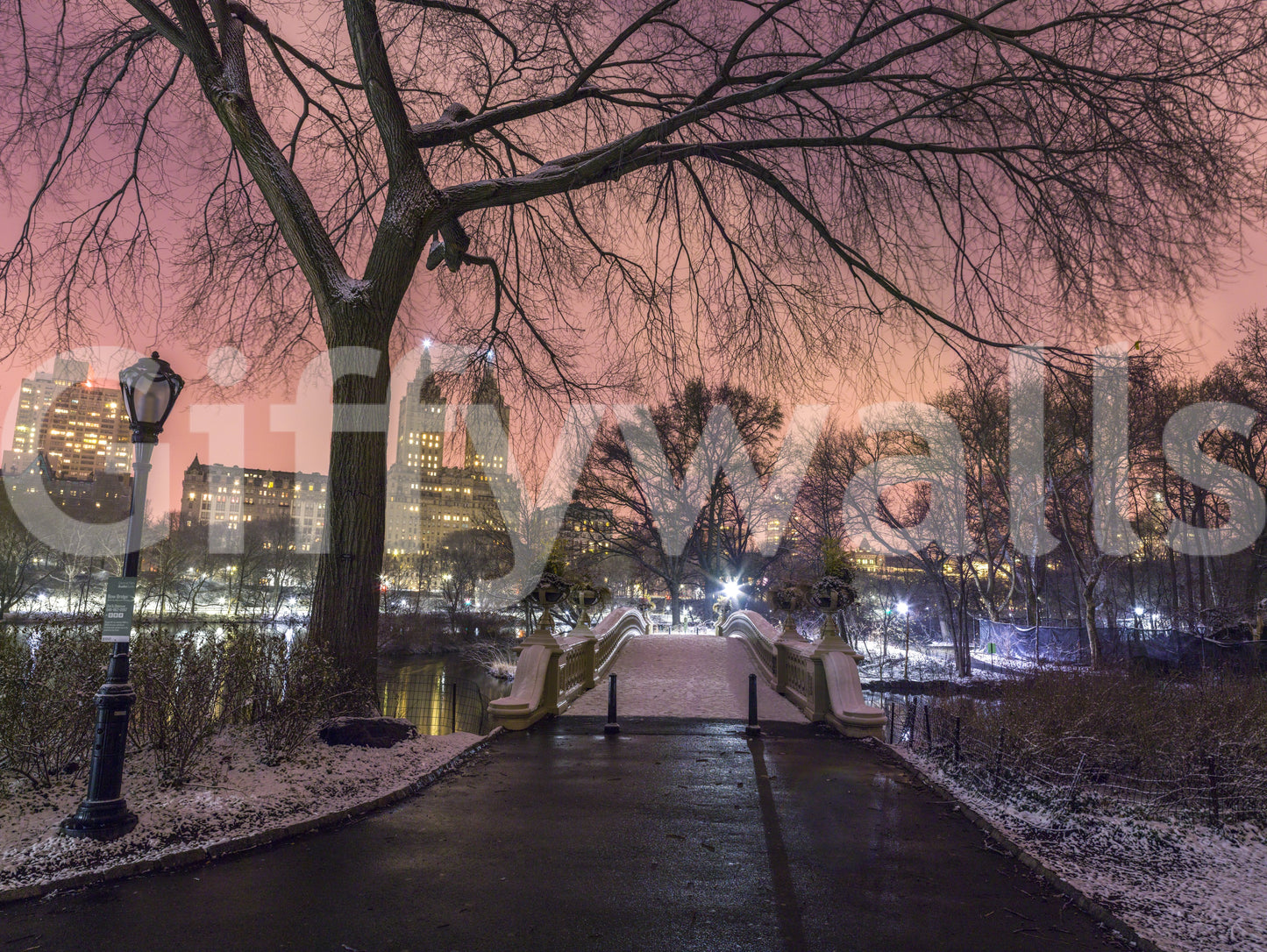 Pink dusk sky reflecting on a winter lake in a large scale wall mural.