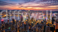 Victoria evening skyline wall mural with bright city lights and purple clouds.