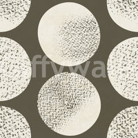 Textured cream polka dot wallpaper with matte finish and organic stippling on brown.