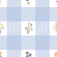 Soft floral gingham wallpaper swatch with pale blue check squares and tiny wildflower sprigs.