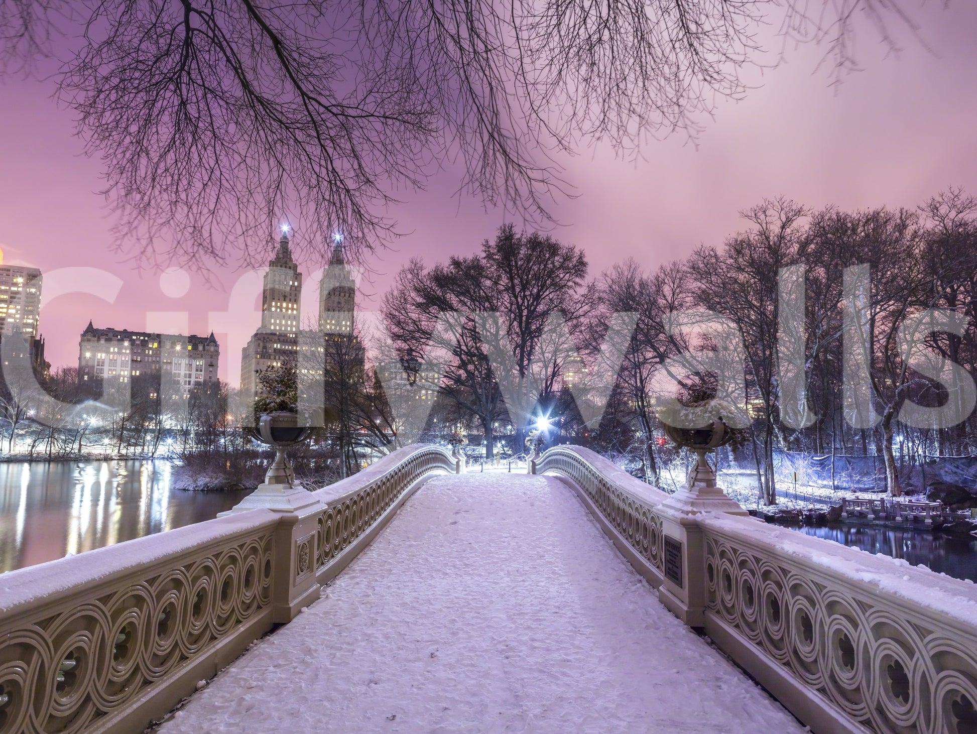 Bow Bridge wall mural showing a snowy Central Park scene at pink dusk.