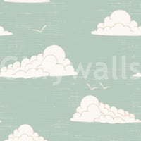 Retro white cloud formations on light sage sky wall mural.