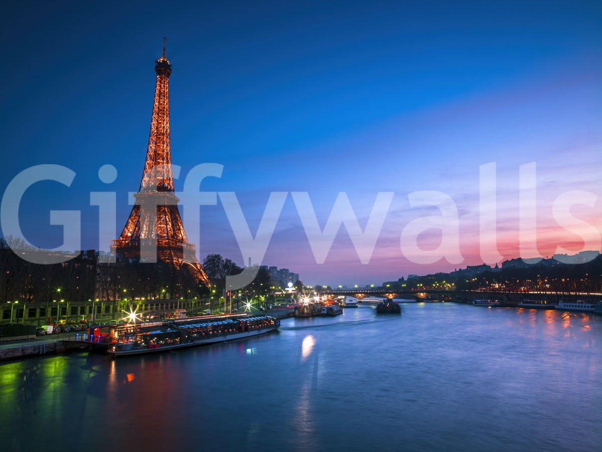Landscape wall mural of Paris at night with a glowing Eiffel Tower and blue river, GD13030