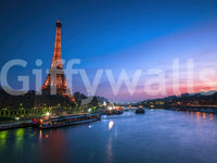 Landscape wall mural of Paris at night with a glowing Eiffel Tower and blue river, GD13030