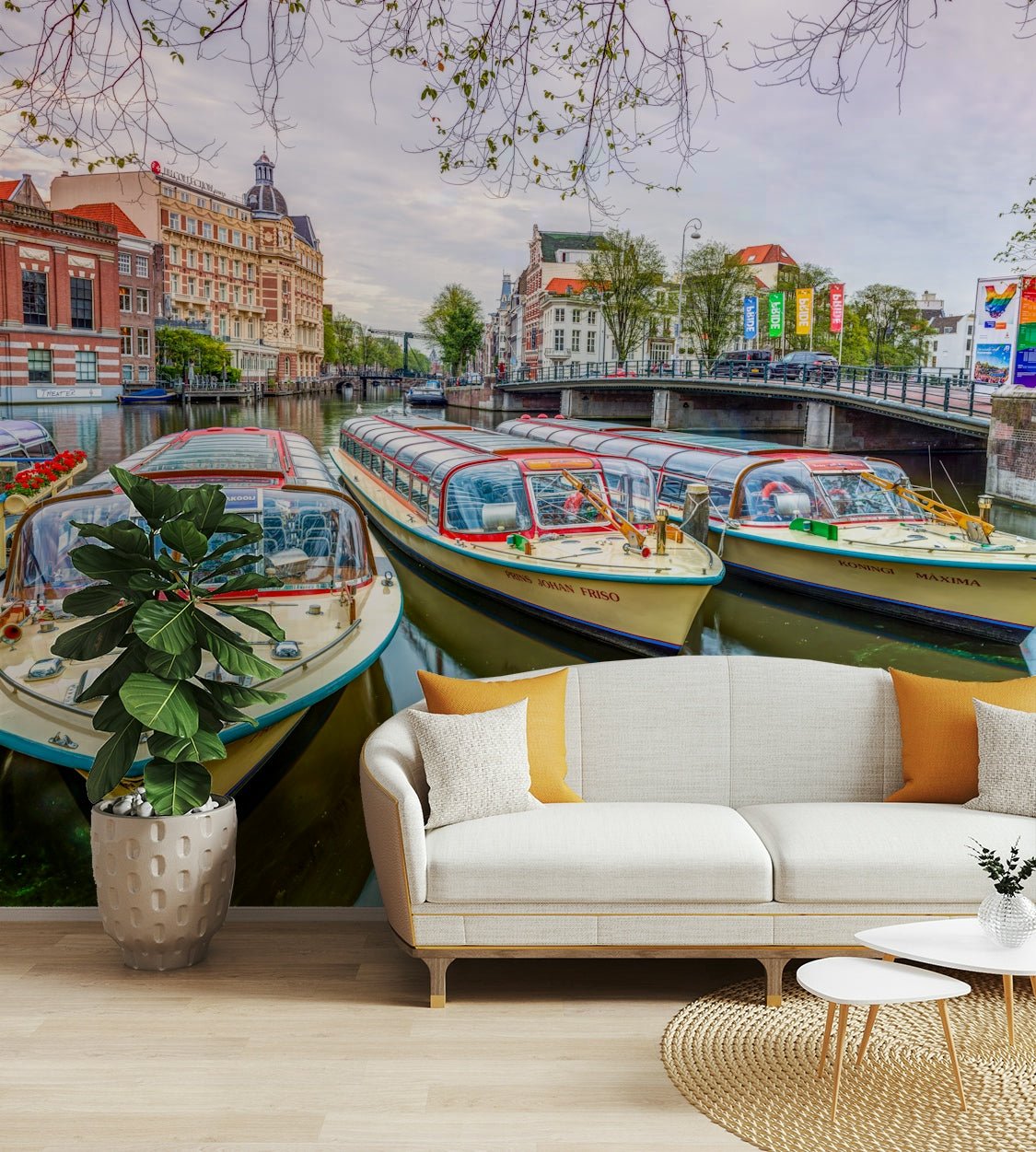 A peaceful wall mural with a view of a canal in Amsterdam.

