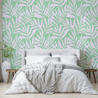 The image features large, stylized palm leaves with a wavy, fluid motion.
