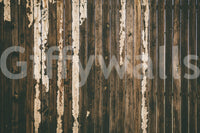 Rustic texture of the Weathered Wood peel and stick mural behind a fireplace.