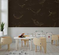Whale Song wall mural with navy tones in a peaceful lounge.