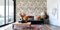 Window-side sitting area featuring whimsical monkey floral blue wallpaper