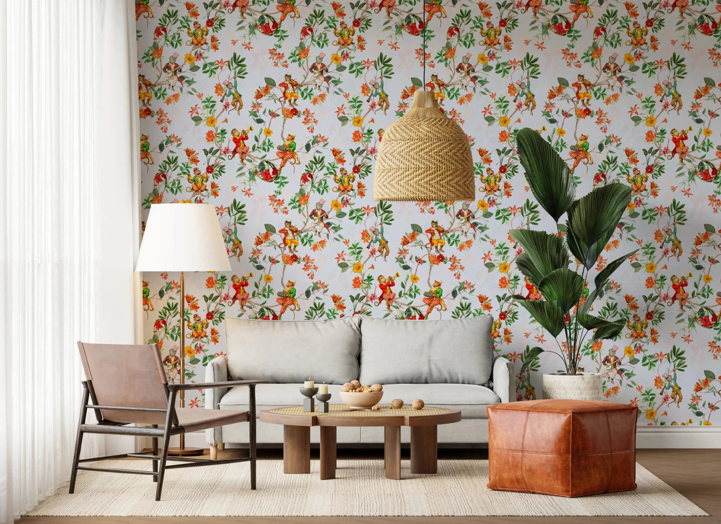 A woven chair and tall plant soften this lounge with vintage monkey floral wallpaper